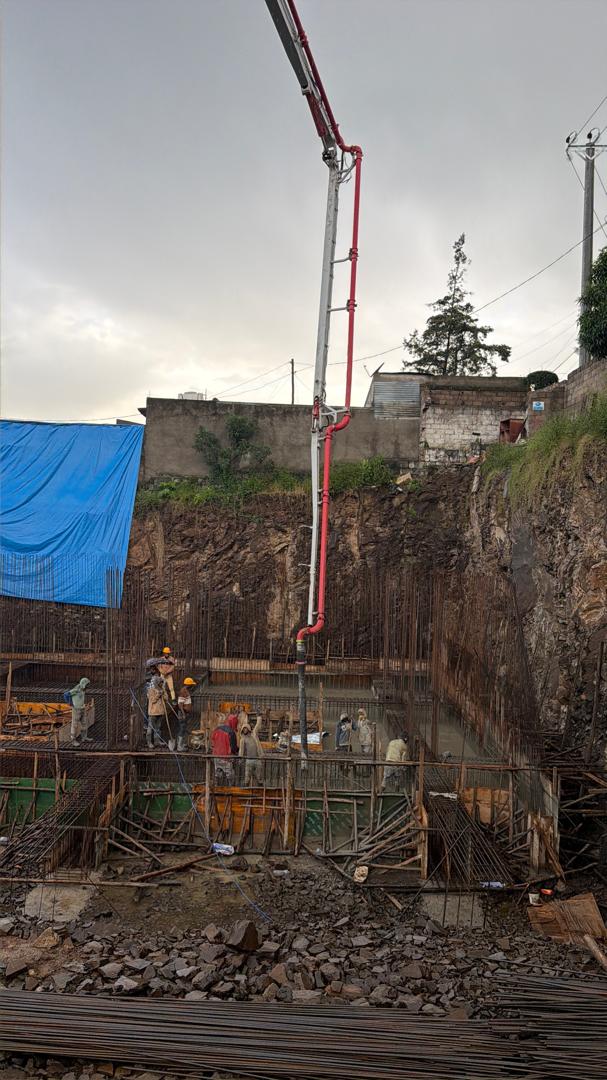 Dream Big Real Estate basement concrete casting with concrete pump